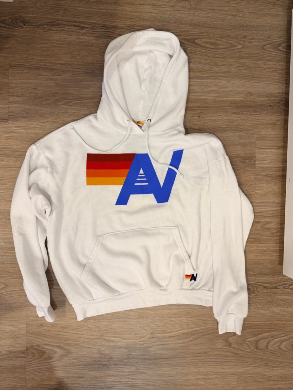 Aviator Nation White Hoodie with Blue Logo and Red-Orange-Yellow Stripes